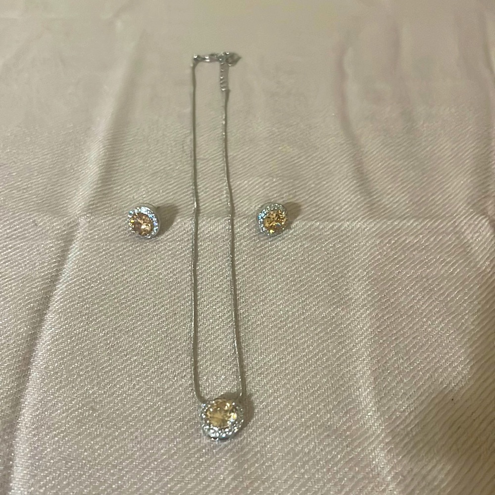 Cubic zirconia earrings and necklace (plush peachy color)